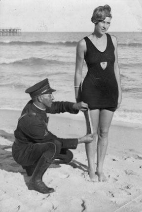 bikini history cop measuring length of bikini