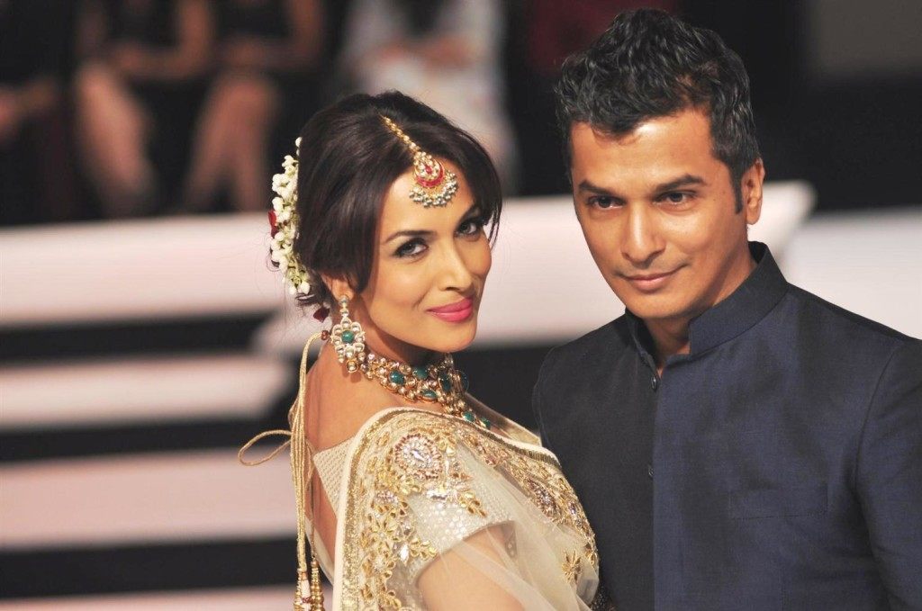 Malaika Arora Khan walking the ramp with designer Vikram