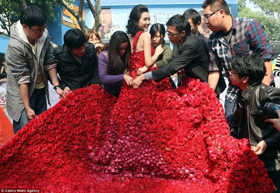 red wedding gown made of roses