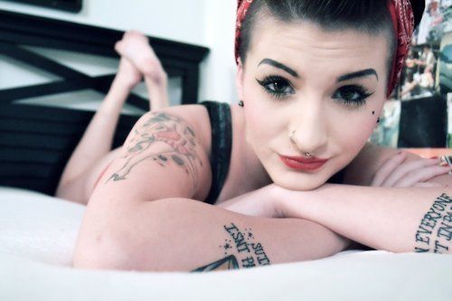 Girl piercing tattoo