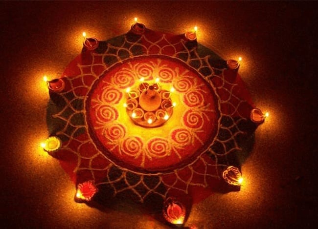Star Rangoli for this Diwali with Diyas Star rangoli for diwali