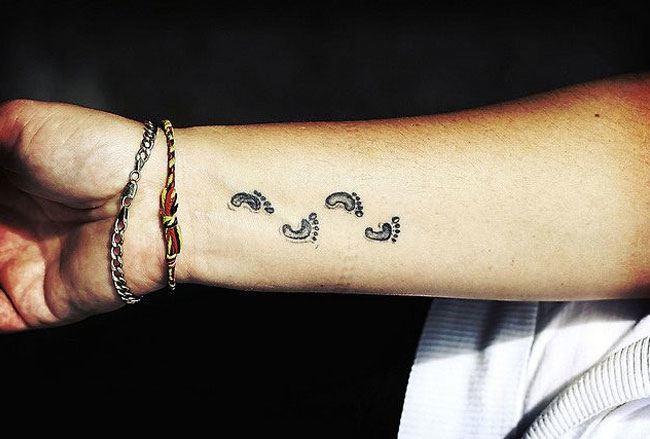 Footsteps wrist tattoo