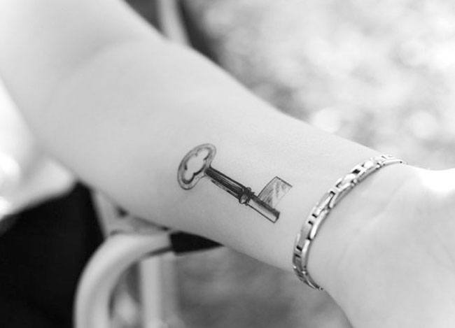 Key wrist tattoo