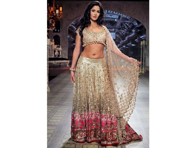 Make a head turning look at your reception with golden lehenga