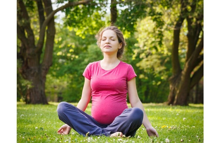 Pregnant Women doing yoga asanas