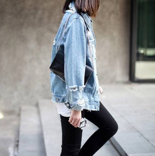 wearing distressed jeans