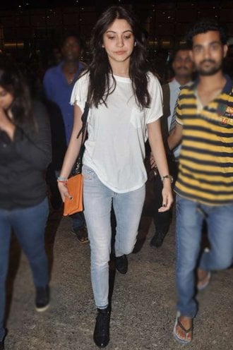 Anushka Sharma in blue jeans and white tee