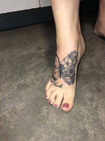 Awesome Black Mandala Flower Tattoo On Girl Foot