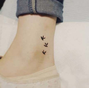 Foot tattoo saying Let it be together with three