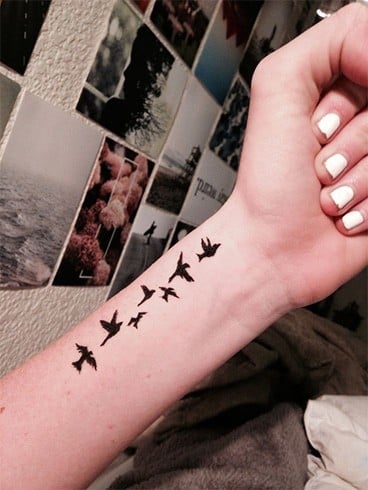 Flying birds tattoo on wrist