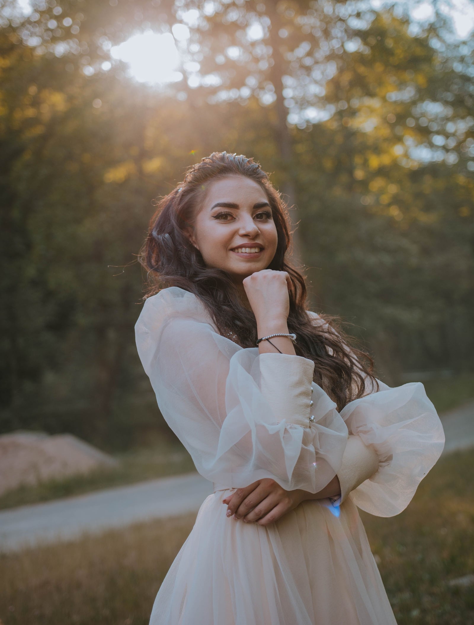Woman wearing a sheer dress in an outdoor setting
