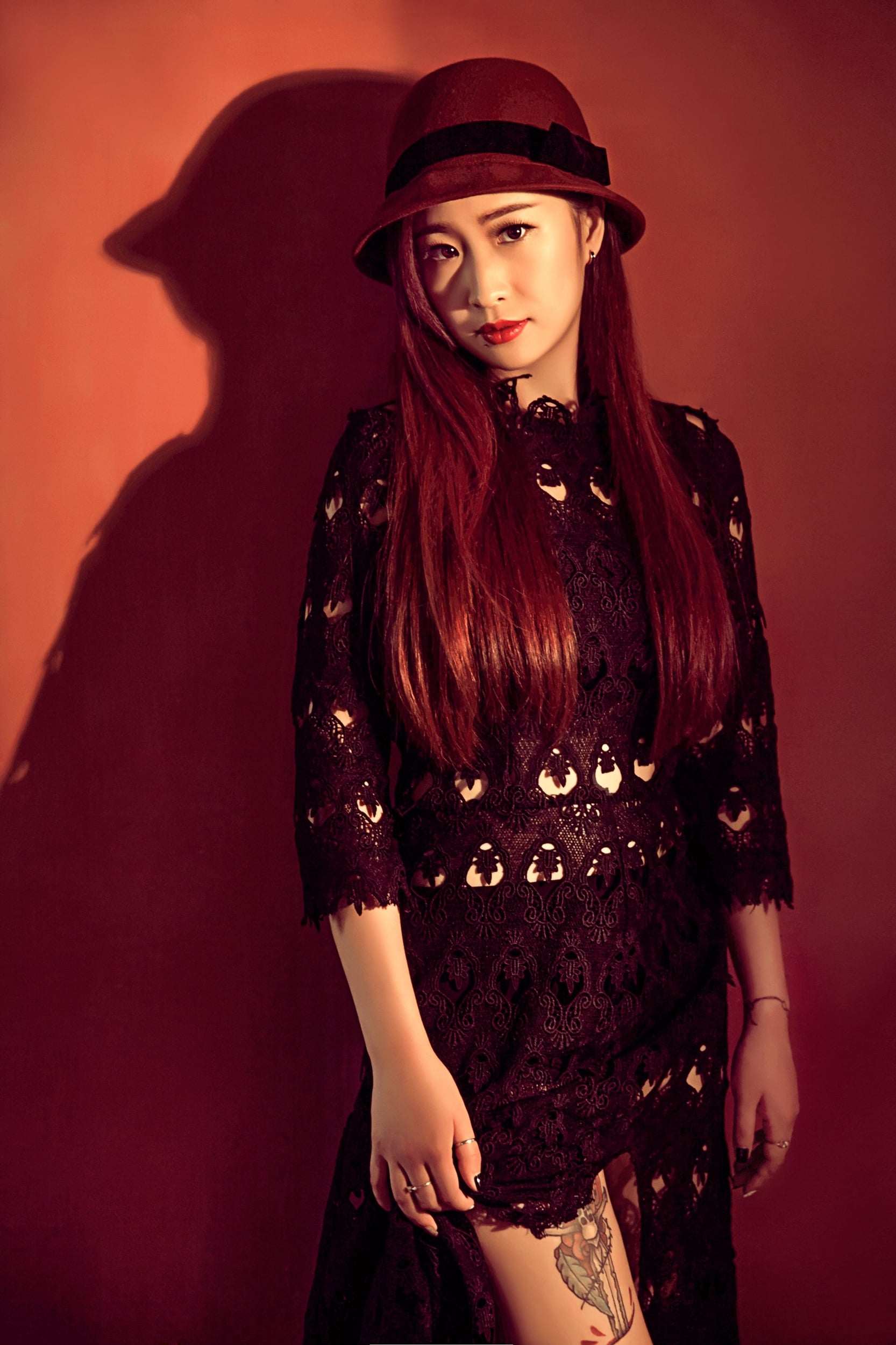 Woman wearing a black lace dress, illustrating dark romantic styling