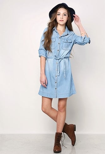 Rolling up the sleeves of long denim shirt-styled dresses