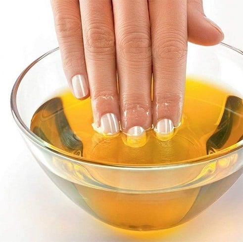 Soak nails in olive oil