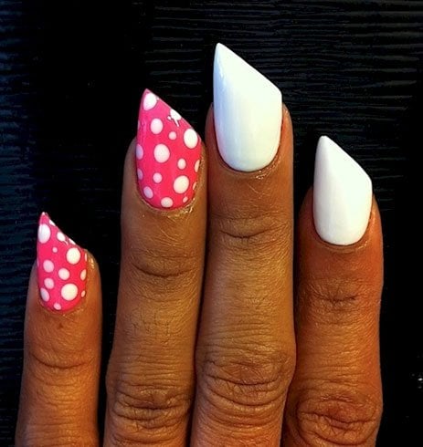 A white and pink polka dot acrylic nail design