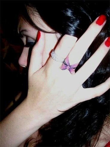 Color Bow Tattoo on Finger Color Bow Tattoo on Finger