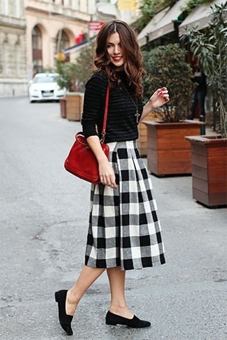 Striped shirt with tartan skirt