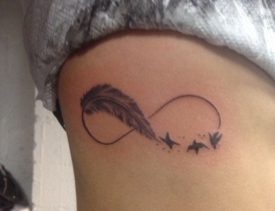 infinity tattoo with feather and birds