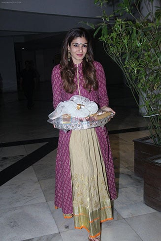 A Long Purple Kurti Paired With A Golden Lehenga.