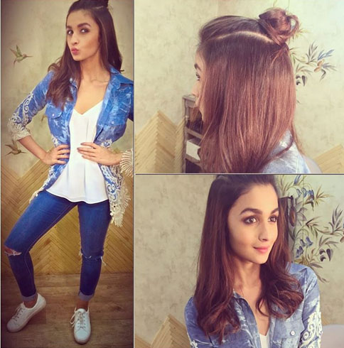 Alia carrying a flawless man-bun hair updo