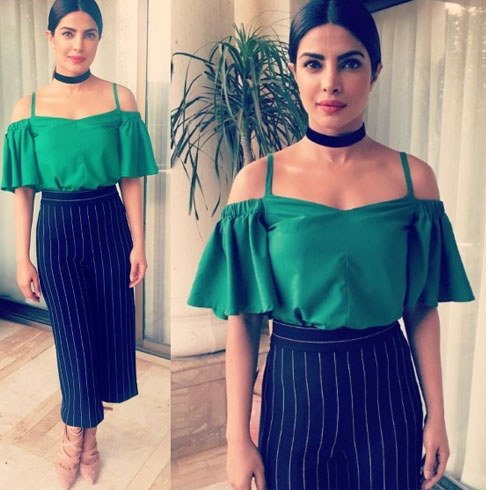 Priyanka in a jade green Shift off shoulder top