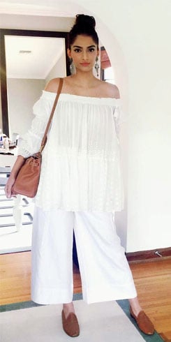 Sonam Kapoor in a white cold-shoulder piece