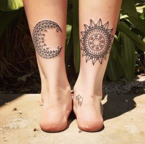 Tribal sun and moon tattoo