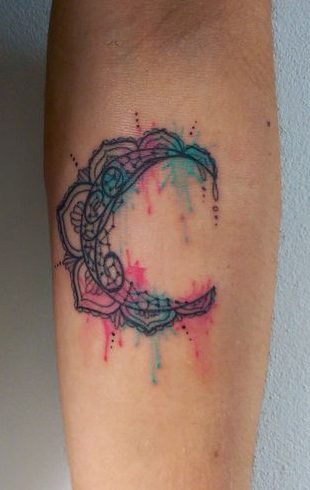 Watercolour sun and moon tattoo