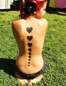 Black Hearts On Spine Tattoo