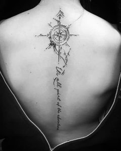 Compass On Spine Tattoo