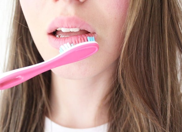 How to use toothbrush on lips