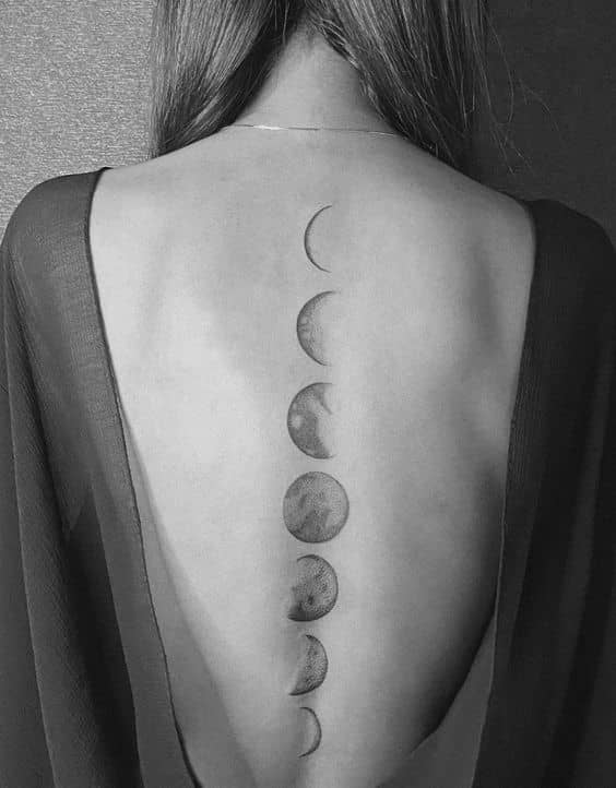 Phases of the moon tattoo  Spine tattoos Trendy tattoos Minimalist tattoo