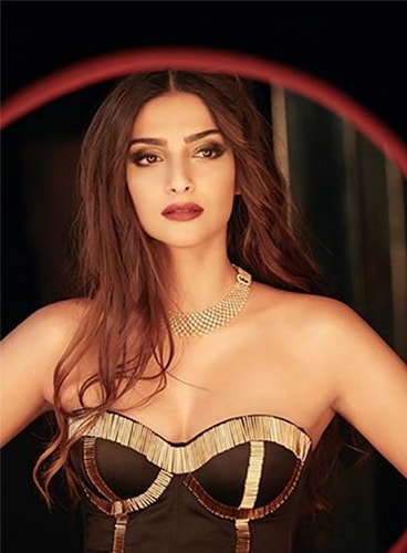 Sonam Kapoor in black and gold bustier top