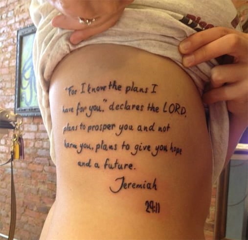 Lettering Rib Cage Tattoo