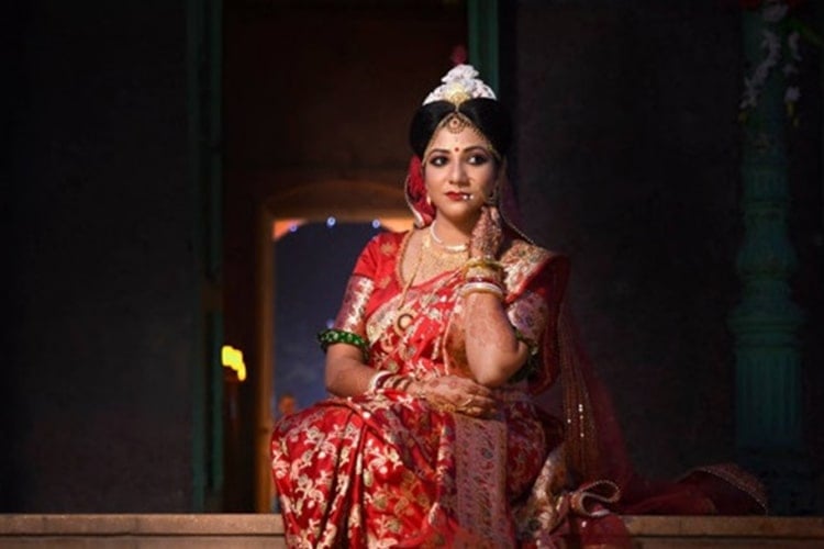 bengali bride in yellow saree